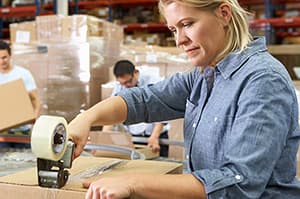 Warehouse team member packing an order